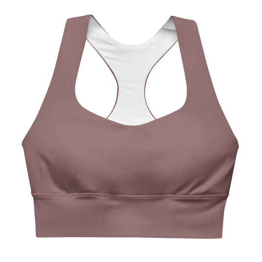 A longline sports bra in a light brown color with double-layered front and shoulder straps, and a mesh lining.
