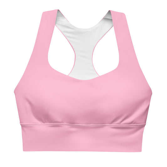A pink longline sports bra with adjustable straps and a mesh lining.