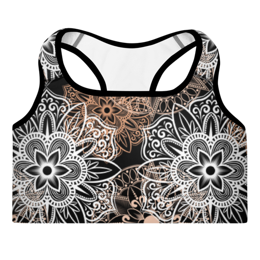 A sports bra with a mandala design in brown and black, featuring padded cups and a scoop neckline.
