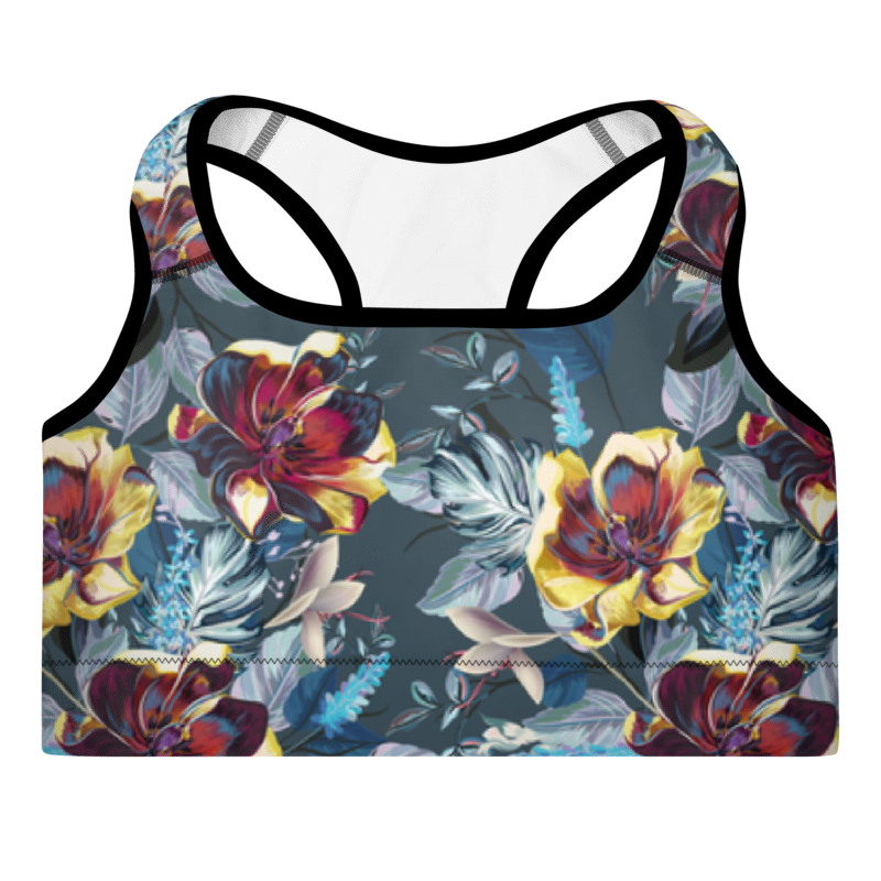 A sports bra with a floral pattern in shades of red, blue, and green on a black background, featuring a scoop neckline and racerback design.