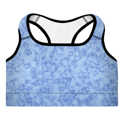 A light blue sports bra with a marble pattern, featuring broad shoulder straps and a scoop neckline.