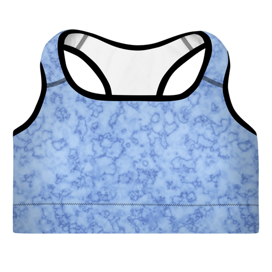 A light blue sports bra with a marble pattern, featuring broad shoulder straps and a scoop neckline.