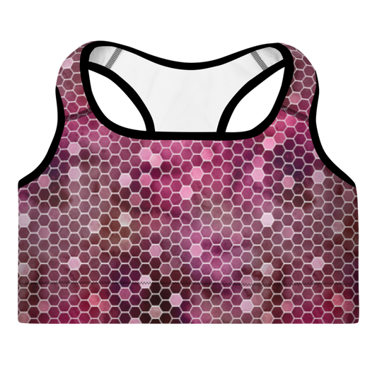 A sports bra with a honeycomb pattern in red and purple colors, featuring a scoop neckline, wide shoulder straps, and a racerback design.