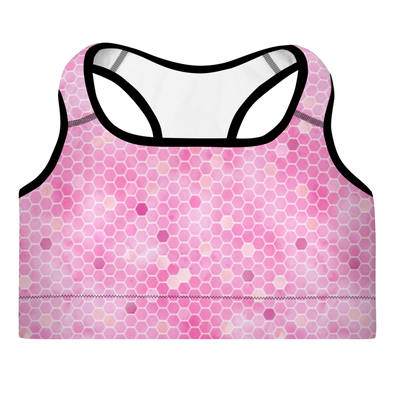 A pink sports bra with honeycomb pattern and shoulder straps, designed for workouts.