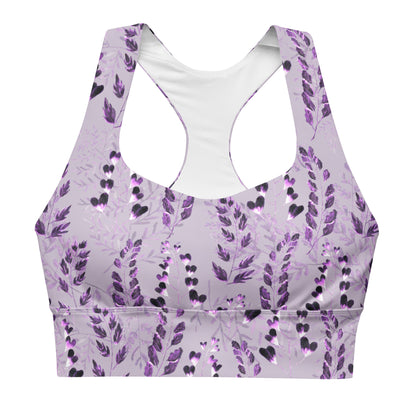 A longline sports bra with a purple floral pattern on a gray background, featuring double-layered front and shoulder straps.