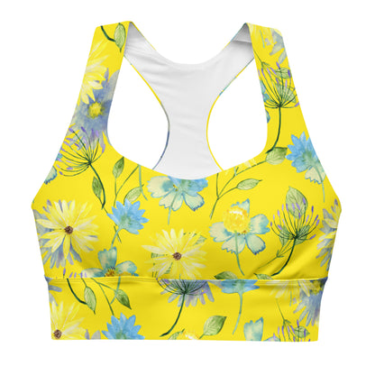 A yellow sports bra with a floral pattern, featuring double-layered front and shoulder straps, and a mesh lining.
