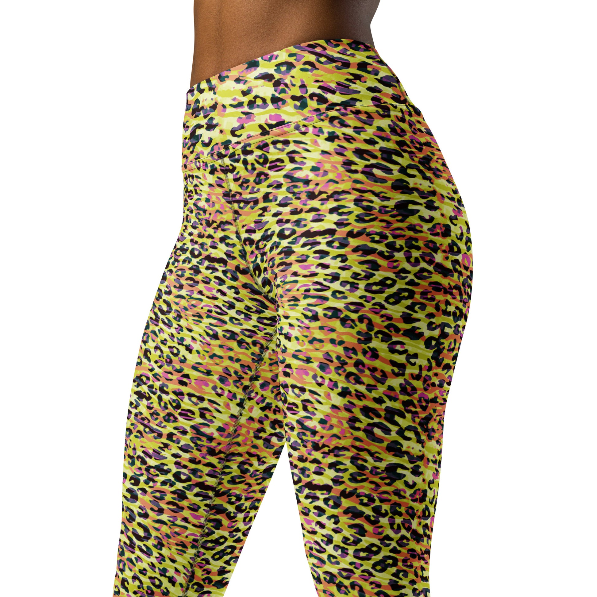 Yoga leggings featuring a zebra and leopard print design in yellow with orange hues.