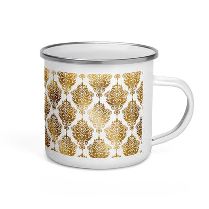 A white enamel mug with a geometric golden pattern design.
